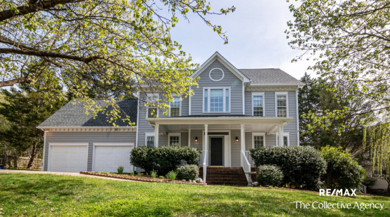 A beautiful new home with a modern exterior, featuring large windows and a welcoming front porch, ready for its first occupants.