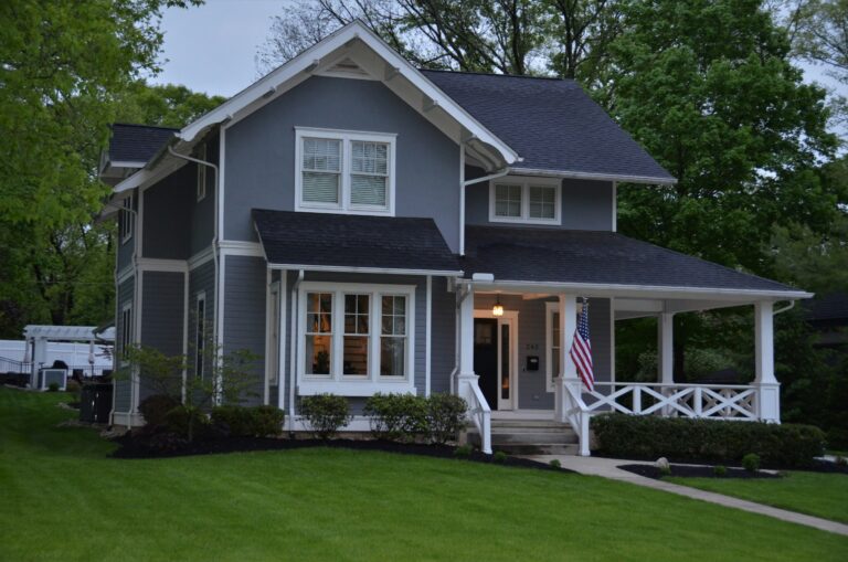 white and gray house near green grass field