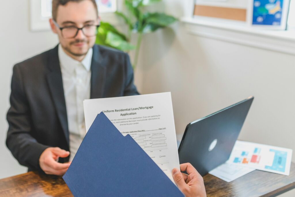 a person holding a loan document