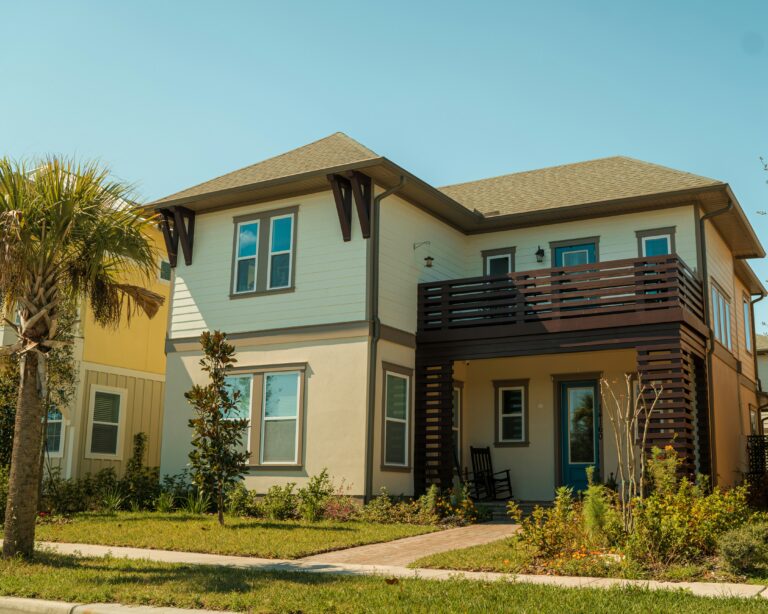 a two story house with a balcony