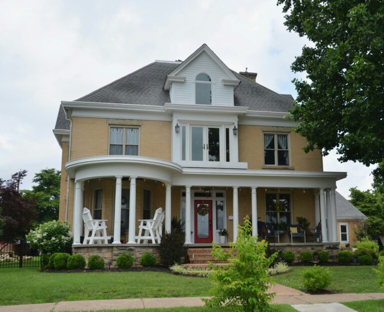 a two story house with a large porch