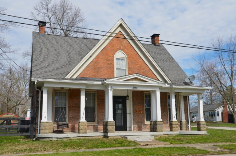 a brick house with a porch